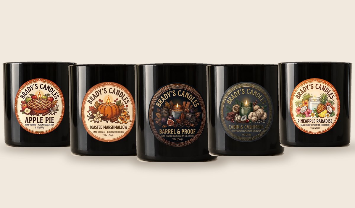 Five Brady's Candles black jars in a row: Apple Pie, Toasted Marshmallow, Barrel & Proof, Cabin & Cashmere and Pineapple Paradise